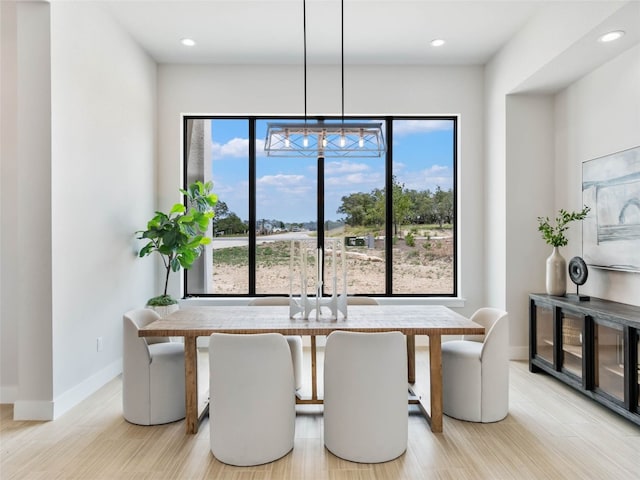 dining area with light hardwood / wood-style floors