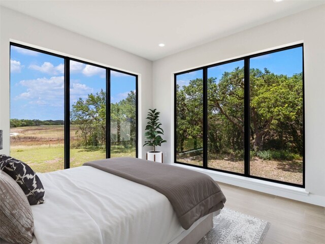 bedroom with hardwood / wood-style flooring