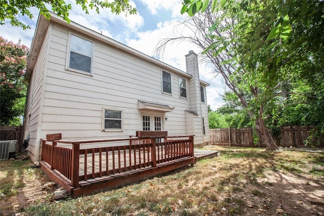 rear view of house featuring a deck