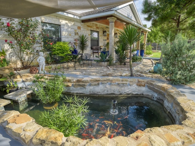 view of swimming pool featuring a patio area