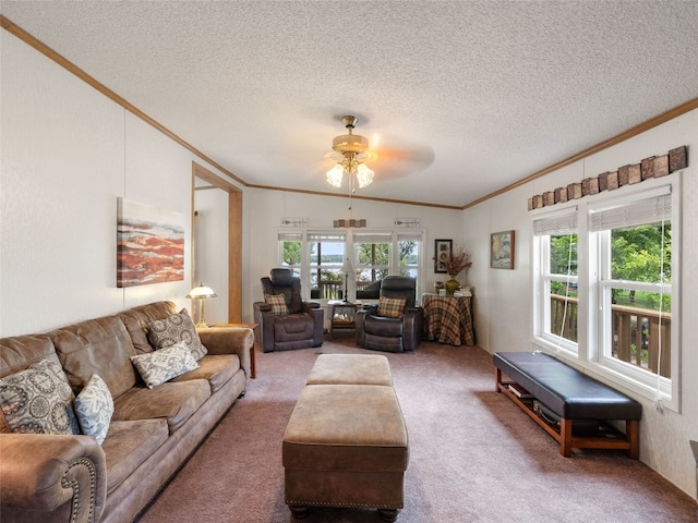 living room with carpet, a textured ceiling, ceiling fan, and crown molding