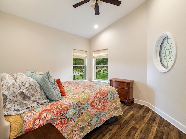 bedroom with dark hardwood / wood-style flooring, lofted ceiling, and ceiling fan