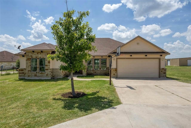 view of front of property featuring a garage and a front yard