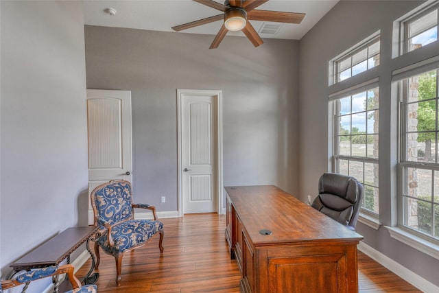 office space featuring ceiling fan and light wood-type flooring