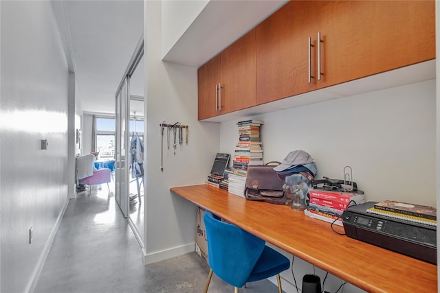 office area with concrete floors