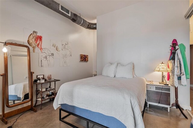 2124 E 6th St Unit 305, Austin, TX 78702 - bedroom featuring finished concrete floors
