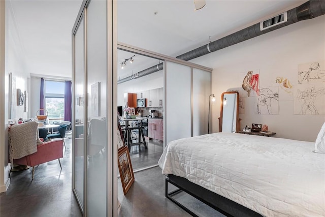 2124 E 6th St Unit 305, Austin, TX 78702 - bedroom with finished concrete flooring