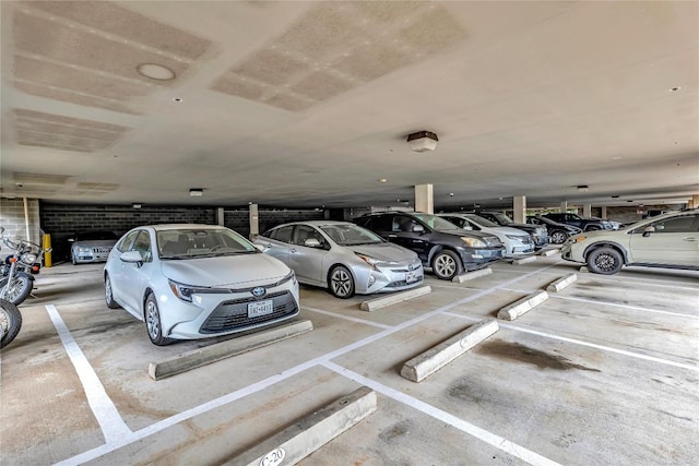2124 E 6th St Unit 305, Austin, TX 78702 - view of parking featuring a parking garage