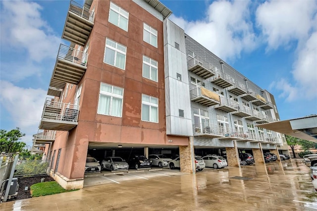 2124 E 6th St Unit 305, Austin, TX 78702 - view of apartment building / complex with covered parking