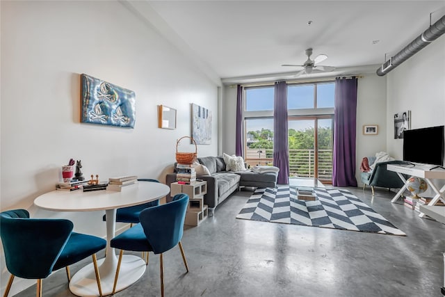 living room featuring concrete floors and ceiling fan