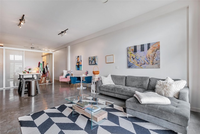 living room with rail lighting and ceiling fan