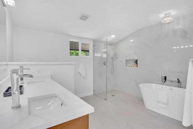 bathroom featuring an inviting chandelier, vanity, lofted ceiling, and shower with separate bathtub