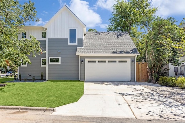 view of front of home with a garage and a front yard