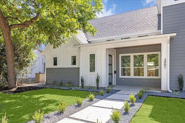 3001 Funston St, Austin, TX 78703 - property entrance with board and batten siding and a yard