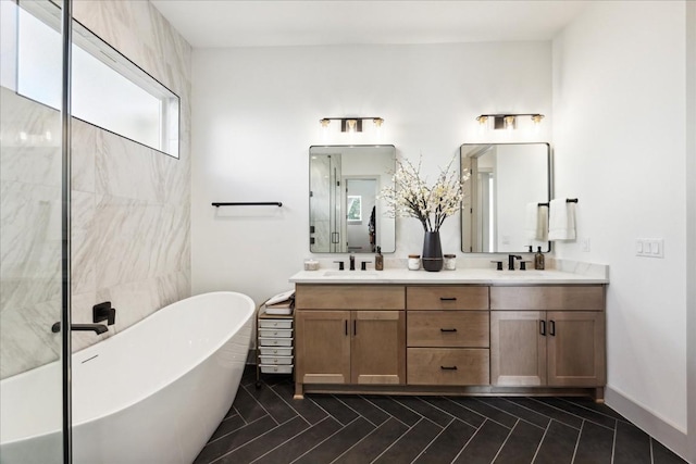 bathroom featuring tile patterned flooring, vanity, and shower with separate bathtub