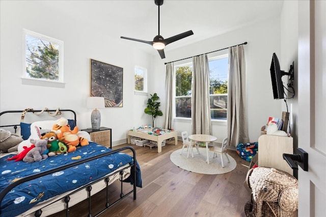 bedroom featuring hardwood / wood-style floors and ceiling fan