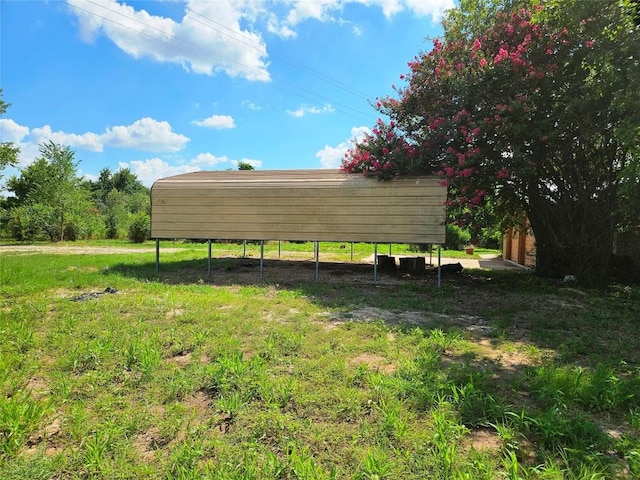 view of yard with a rural view