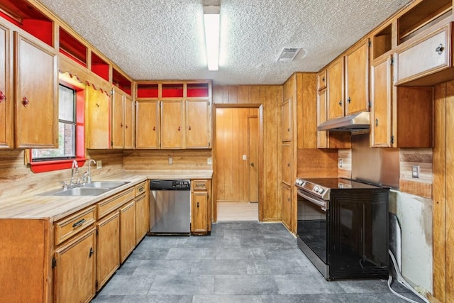 kitchen with a textured ceiling, stainless steel dishwasher, range with electric stovetop, and sink