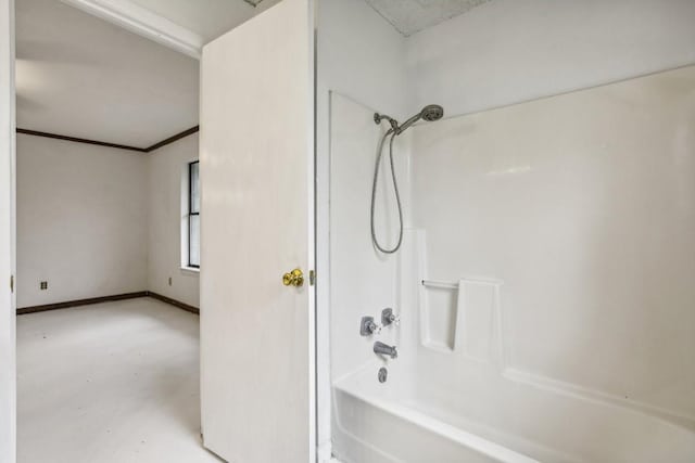 bathroom featuring shower / bathing tub combination and concrete floors