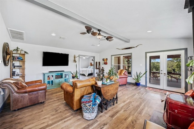 living room with ceiling fan, french doors, lofted ceiling with beams, and light wood-type flooring