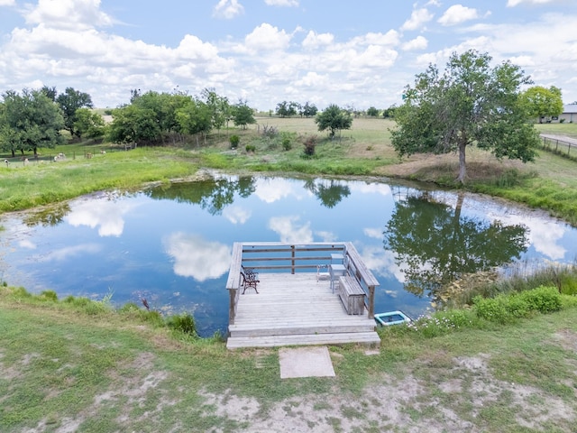 view of dock featuring a water view and a rural view