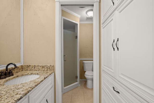 8712 Cele Rd Unit 1, Manor, TX 78653 - full bath with crown molding, toilet, vanity, a shower stall, and tile patterned floors