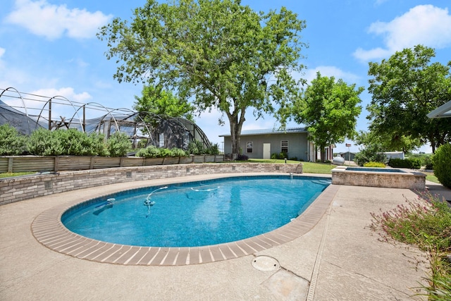 view of pool featuring an in ground hot tub and a patio area