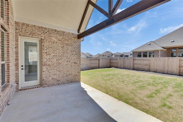 view of yard with a fenced backyard and a patio