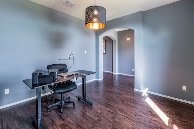 office space with dark hardwood / wood-style flooring