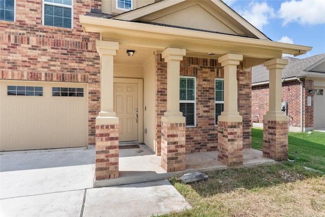 view of exterior entry featuring covered porch