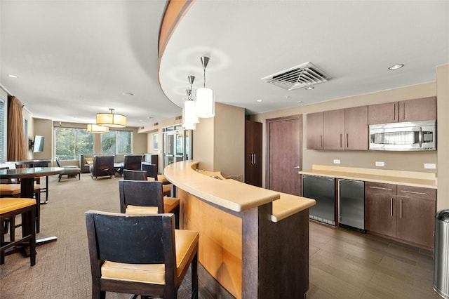 kitchen featuring appliances with stainless steel finishes and pendant lighting