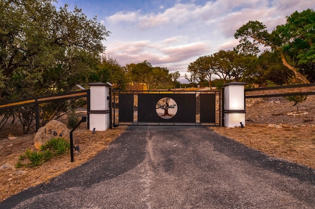 view of gate at dusk