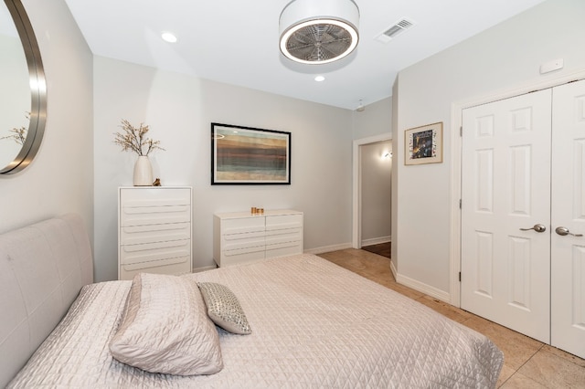 bedroom featuring a closet and light tile patterned floors