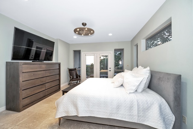 bedroom featuring light tile patterned flooring, french doors, and access to exterior