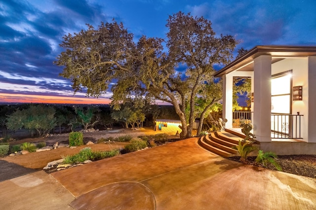 view of patio terrace at dusk