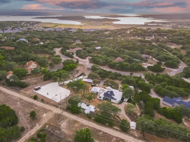 aerial view at dusk with a water view