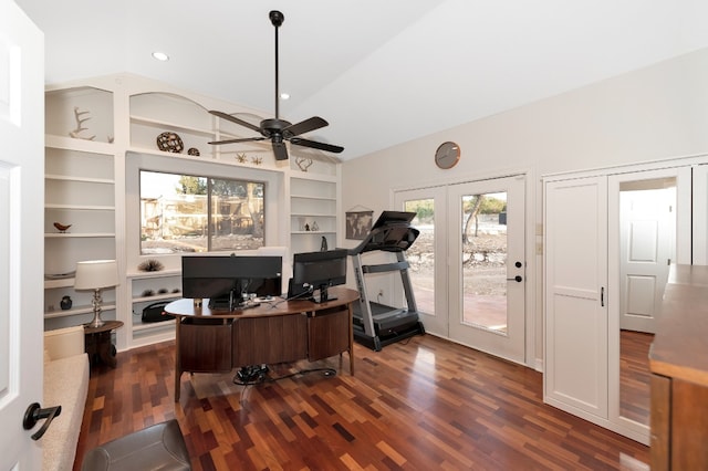 home office with built in features, lofted ceiling, ceiling fan, and dark hardwood / wood-style floors