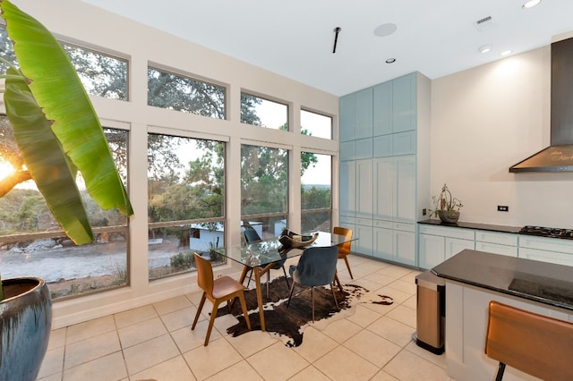 dining room featuring light tile patterned floors and plenty of natural light