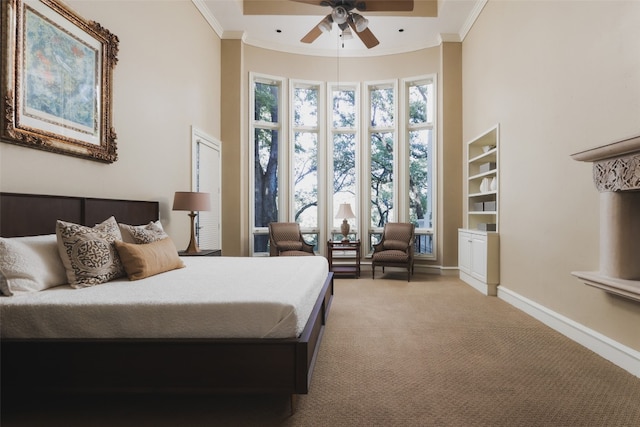 bedroom featuring crown molding, ceiling fan, and carpet flooring