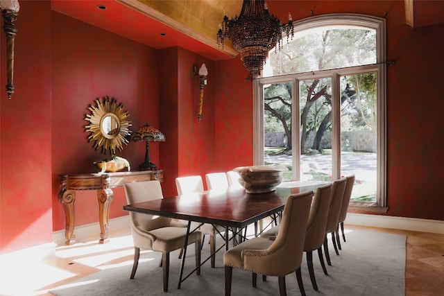 dining space featuring an inviting chandelier and tile patterned flooring