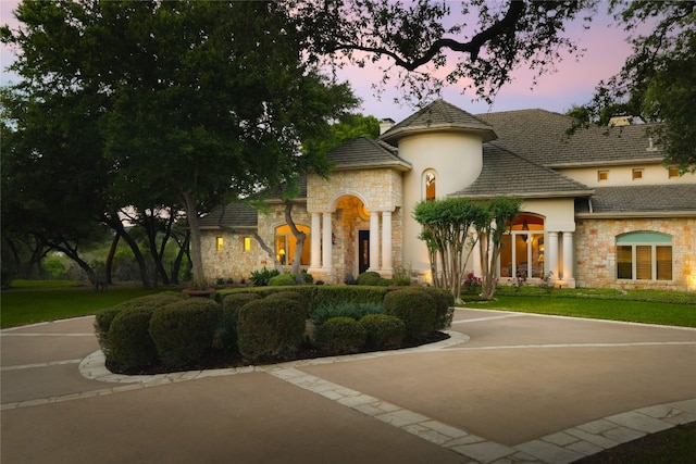 view of front of home with a yard