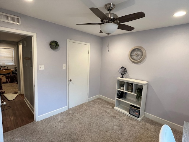 unfurnished bedroom featuring ceiling fan and carpet flooring