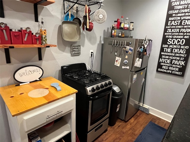 kitchen featuring dark hardwood / wood-style floors and stainless steel appliances