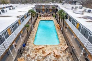 snow covered pool featuring a patio