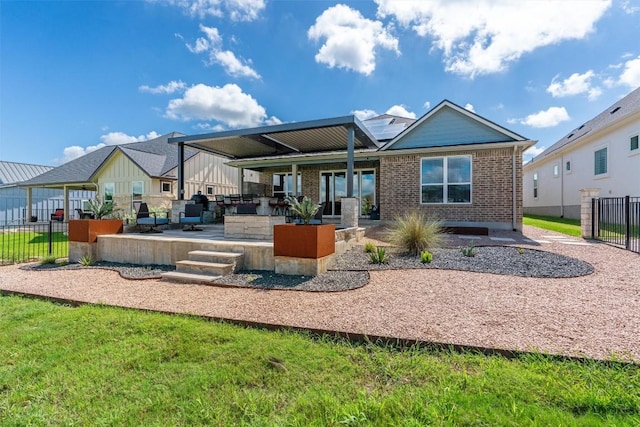 rear view of property featuring a patio