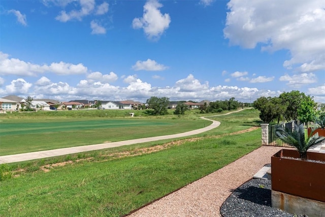 view of property's community with a lawn