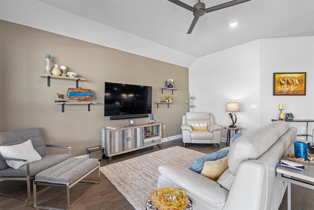 living room with lofted ceiling, ceiling fan, and dark wood-type flooring