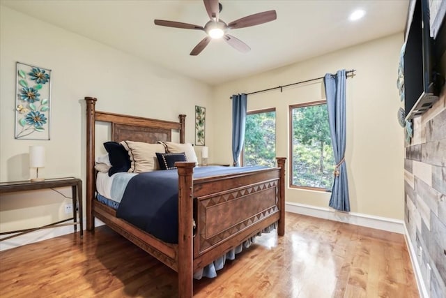 bedroom featuring hardwood / wood-style flooring and ceiling fan