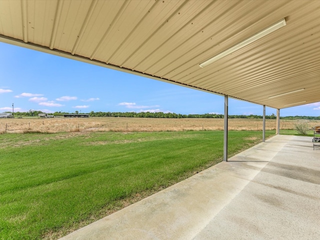 view of yard with a patio area and a rural view