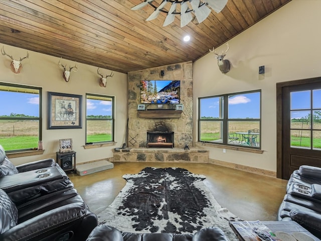 living room with concrete flooring, a fireplace, ceiling fan, lofted ceiling, and wood ceiling